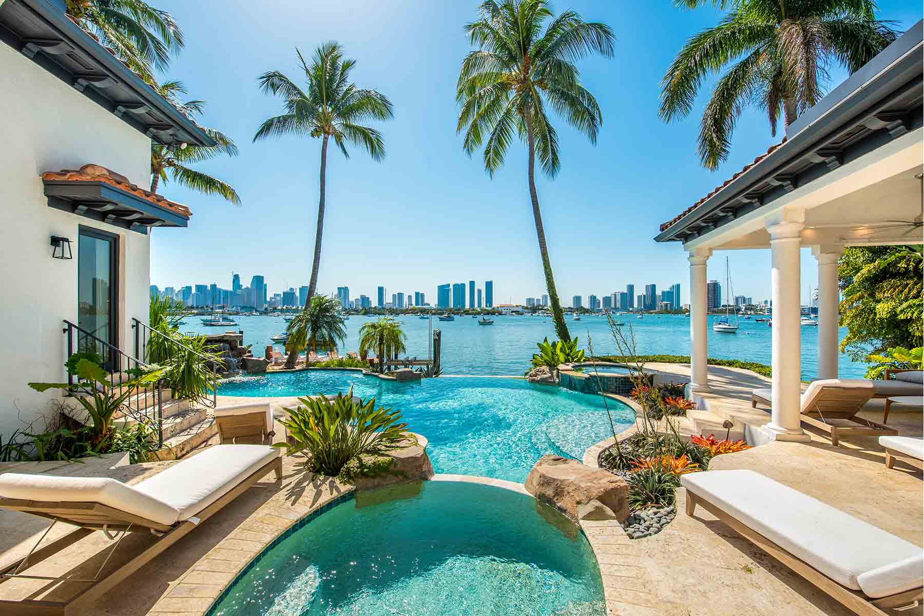 A pool in Florida with a scenic overlook of the city of Miami in the background A pool in Florida with a scenic overlook of the city of Miami in the background
