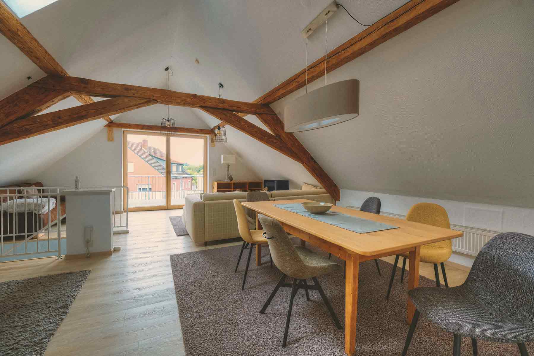 Cozy loft conversion with sofa and dining Cozy loft conversion with sofa and dining