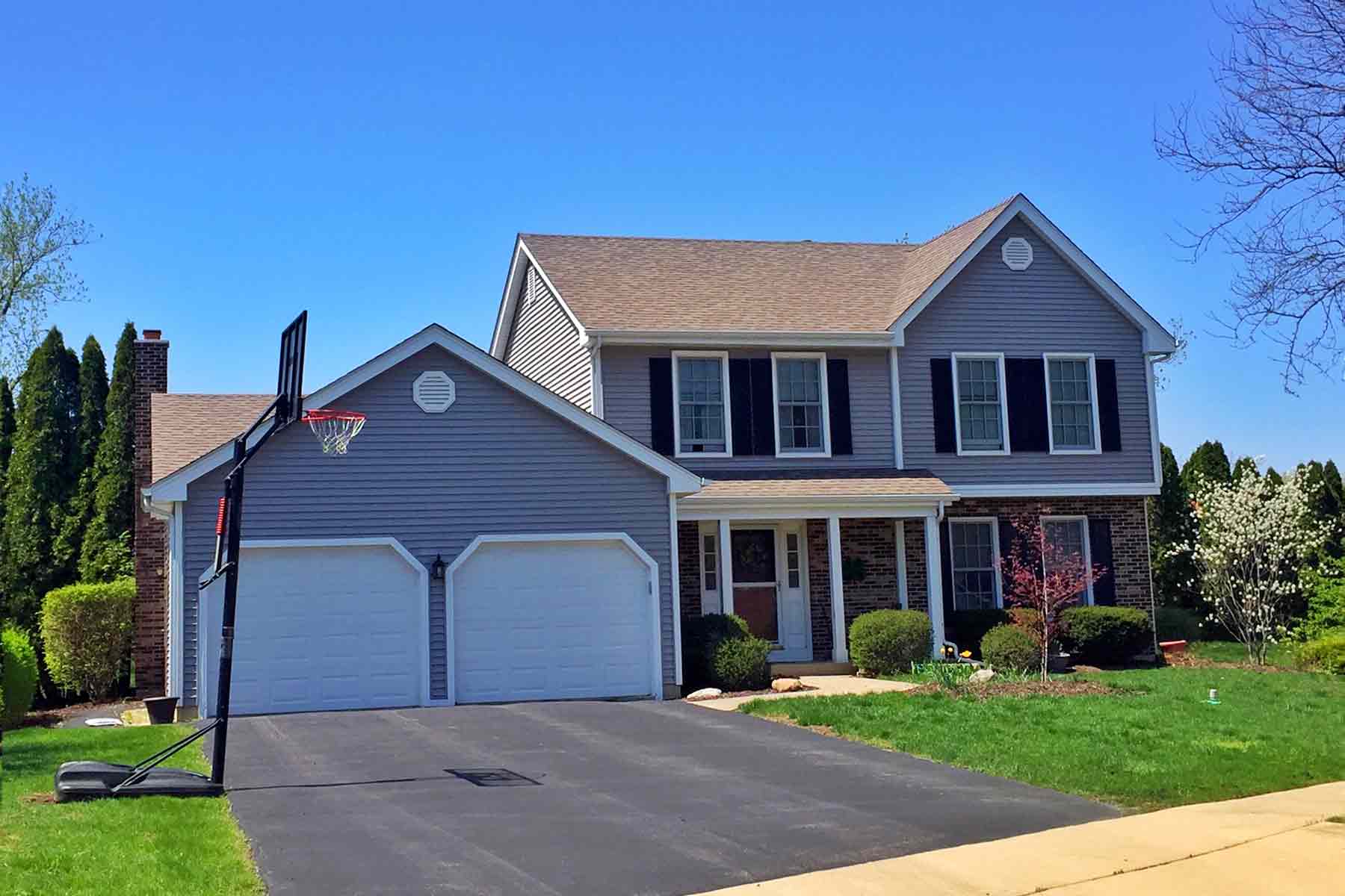 Two-story suburban home in Illinois with two-car garage Two-story suburban home in Illinois with two-car garage