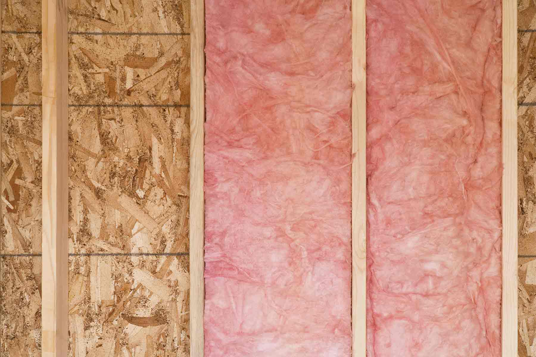 Strips of fiberglass insulation in a drywall